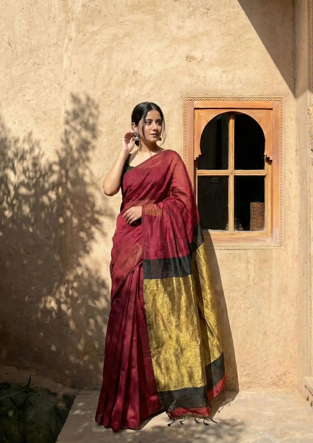 Tarini Maroon and Black Cotton Saree with Gold Tissue Border